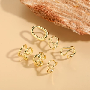 Set of 6 gold plated ear cuffs and open rings with geometric and woven chain textures