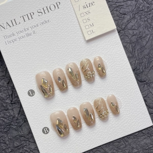 Handmade champagne gold glitter press-on nails with rhinestones and luxury French style