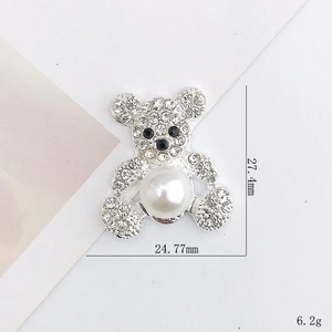Silver bear accessory with rhinestones and pearls measuring 24.77mm by 27.4mm