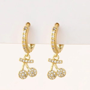 Close-up of golden cherry earrings featuring sparkling micro-pave white zircons for women