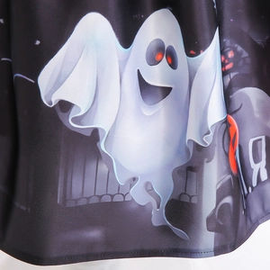 Close-up of cute cartoon white ghost print on Halloween witch dress fabric