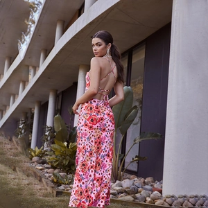 Detail of cross-tie back design on floral halter maxi dress with pink flower print