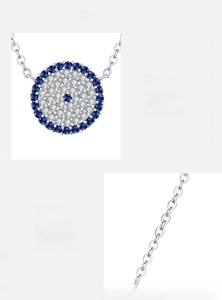 Macro detail of S925 sterling silver evil eye pendant with inlaid blue and white zircons