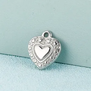 Silver heart pendant with embossed patterns and polished center for jewelry making