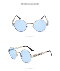 Detail of silver steampunk sunglasses with blue lenses and intricate metal spiral temples