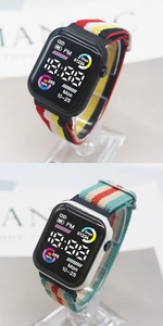 Digital sport watch detail with colorful nylon straps and vivid square LED displays