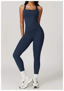 Detail of navy blue high-waist yoga set showing slim-fit tank top and athletic leggings