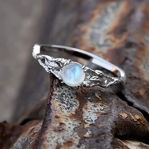 Nature-inspired silver branch open ring with moonstone and leaf texture details