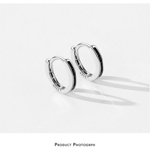 Detail of S925 sterling silver hoop earrings with rectangular black stone inlay