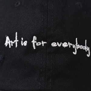 Black denim baseball cap with distressed details and Art is for everybody embroidery