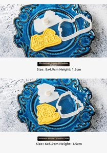 Macro shot of 3D house-shaped cookie cutters showing detailed window and tile patterns