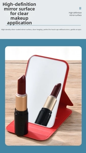 Detail showing high-definition silver-plated mirror surface with red faux leather cover