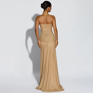 Elegant gold off-the-shoulder evening gown with shimmering fabric and floor-length hem