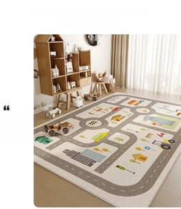 Detailed view of beige kids activity rug featuring grey city traffic routes and houses