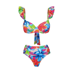 Detail of ruffle straps and colorful floral print on two-piece bikini beachwear set