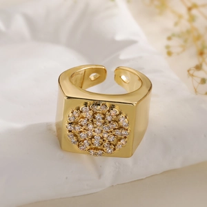 Top macro view of wide 18K gold plated ring with cubic zirconia on stone base