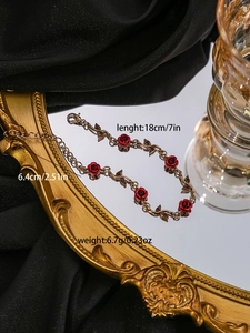 Detailed size and weight specs for vintage red rose bracelet with gold metal leaf design