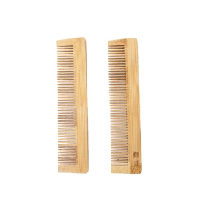 Eco-friendly natural bamboo hair comb set with ergonomic handles on white background