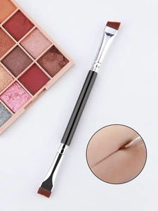 Dual-head makeup brush detailing angled liner brush and flat eyeshadow brush on white background