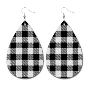Detailed view of teardrop PU leather earrings featuring classic black and white buffalo plaid