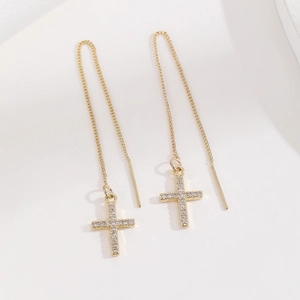 Elegant gold plated copper cross threader earrings with cubic zirconia stones on white background
