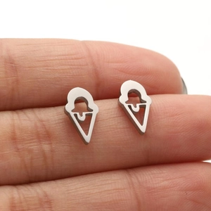 Macro shot of silver ice cream cone stud earrings showing polished stainless steel finish