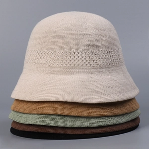 Close-up of multi-color breathable knit bucket hats showing five various neutral tones