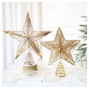 Detail of glittery gold and silver star tree toppers with spring base and metal wire texture