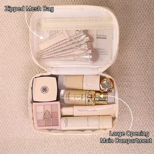 Borsa per cosmetici in cotone trapuntato con fiocco, grande scomparto e tasca a rete