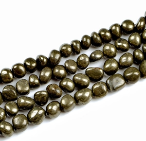 Macro shot of irregular natural golden pyrite loose beads for DIY jewelry making
