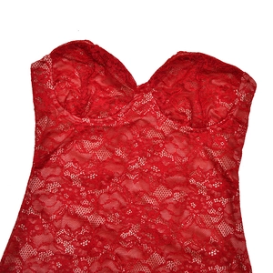Detail of red floral lace top with mesh texture and strapless cup design for women