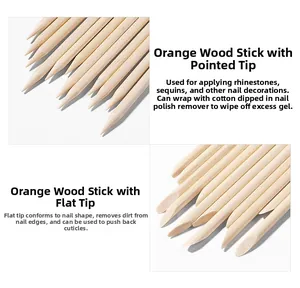 Detailed view of dual-ended orange wood nail sticks with pointed and flat tips for manicure