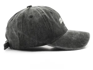 Side view of washed cotton baseball cap featuring white LOS letter embroidery detail