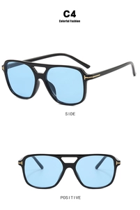 Detail view of square pilot sunglasses with blue lenses and golden T-shaped metal hinges