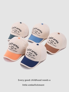 Close-up of cotton kids baseball caps in navy, orange, green and blue with color blocking