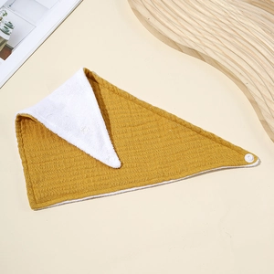 Yellow double-layer cotton muslin baby bandana bib with snap button closure and soft texture