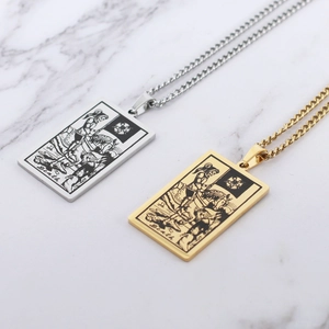 Gold and silver tarot death card necklaces on white marble background with rectangle pendants