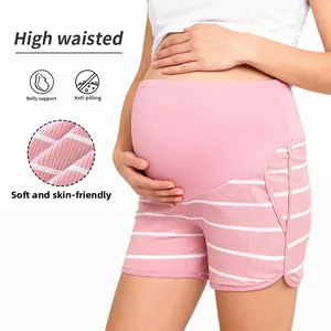 Macro detail of high waisted pink striped maternity shorts with soft belly support fabric