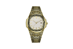 Macro shot of gold-plated carved watch featuring white dial with date window