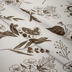 Detail of bohemian tapestry fabric showing beige moon and botanical leaf line art