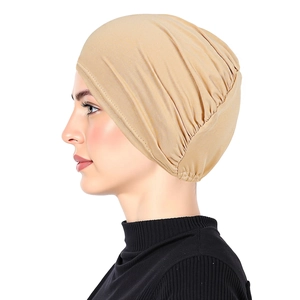 Women's plain beige headscarf cap made of soft elastic fabric on a white background