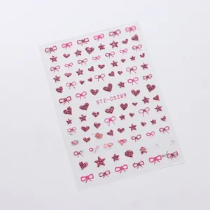 Detail of pink glitter nail stickers featuring heart, star, and bow patterns (STZ-CS289)