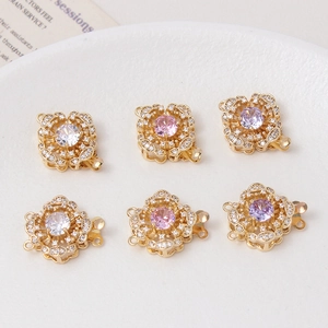 Macro shot of 14K gold plated flower clasps with micro-set zircons for DIY jewelry