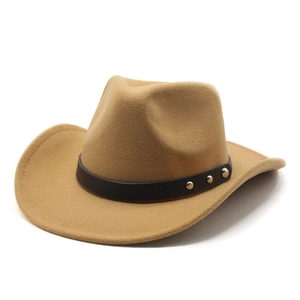 Detail of khaki felt western cowboy hat with brown studded band and silver rivets