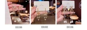 Detailed view of three gold tassel earrings with pearls, bows, and S925 silver needles