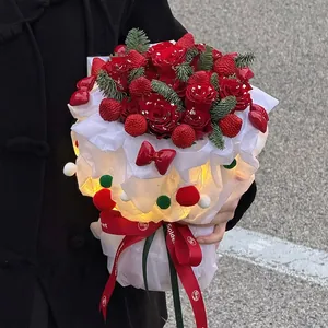 Luminous Christmas bouquet with red roses, fresh strawberries, pine and warm LED lights
