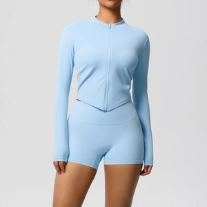 Close-up of light blue slim fit yoga set with zip-up top and high waisted sports shorts