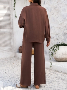 Detailed back view of brown cotton linen blend two-piece lounge set with textured fabric