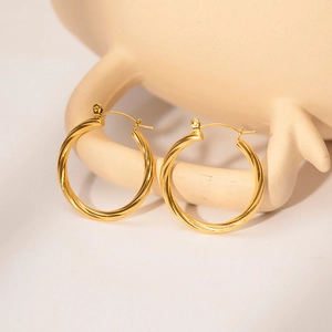 Stylish gold plated twisted hoop earrings with elegant spiral texture for women