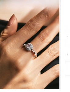 Close-up of a 925 silver ring featuring a square pink stone with halo and marquise accents
